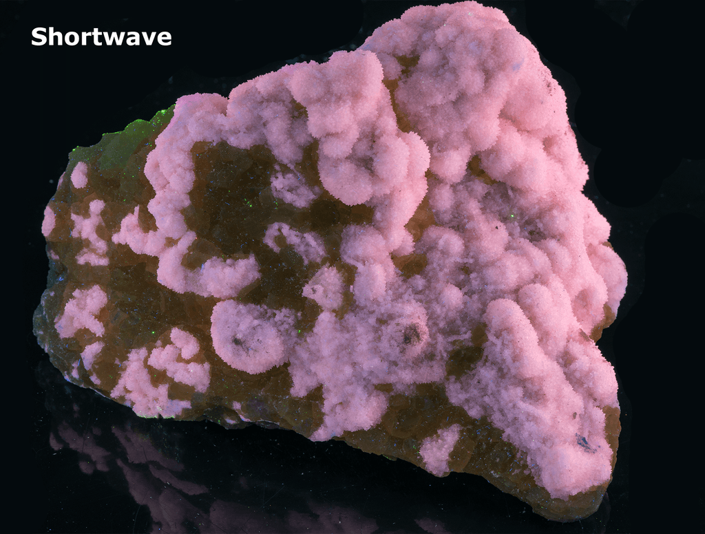 Yellow sulphur crystals sit atop an aragonite matrix