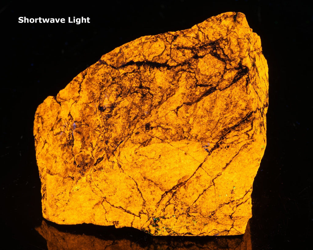 Wollastonite displaying a bright yellow fluorescence under 254nm shortwave UV light
