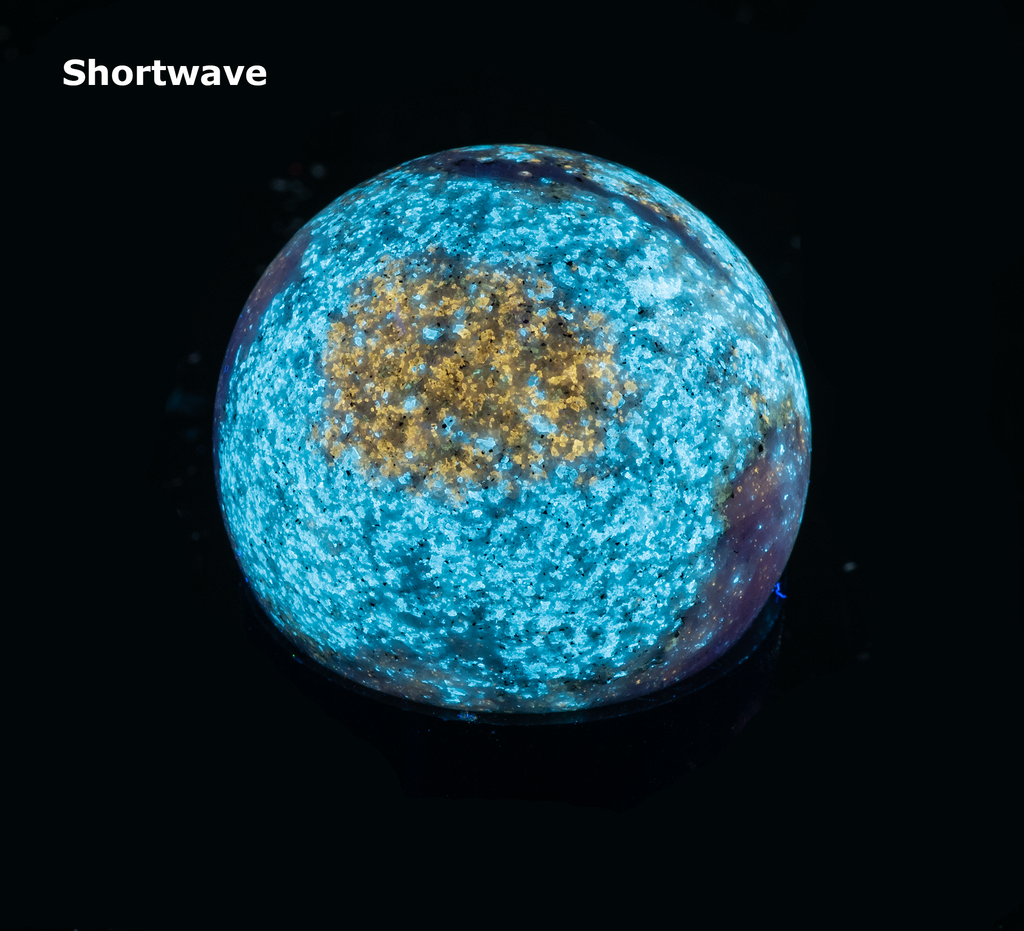 fluorescent diopside and chondrodite sphere from canada