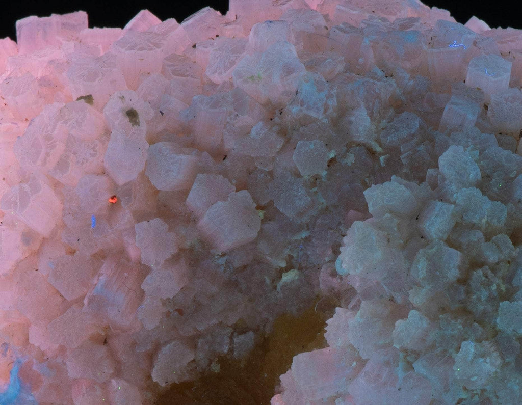 Yellow sulphur crystals sit atop an aragonite matrix