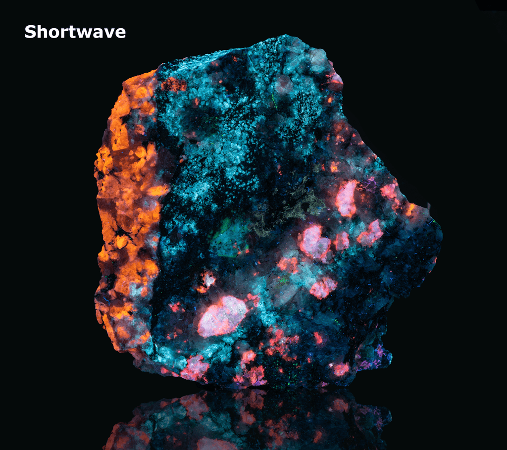 A piece of our highly sought after "Fantasy Rock". This piece features rich tugtupite that fluoresces a deep cherry red under shortwave UV.