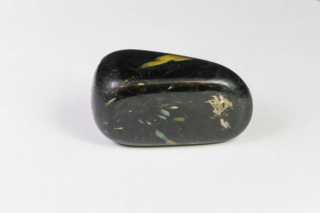 A beautiful tumbled nuummite stone