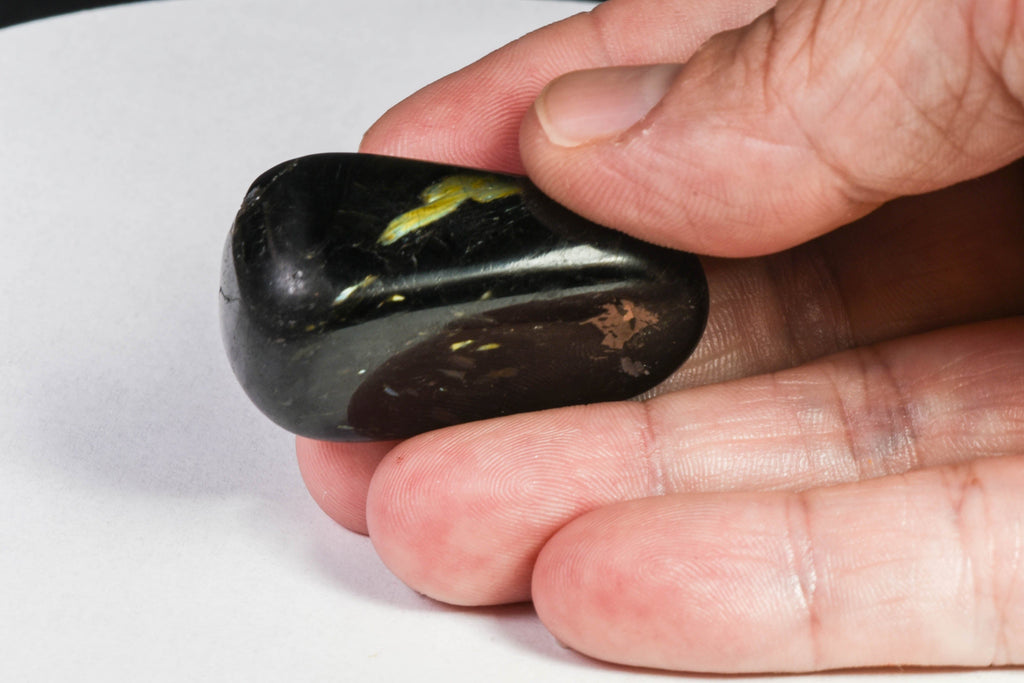 A beautiful tumbled nuummite stone