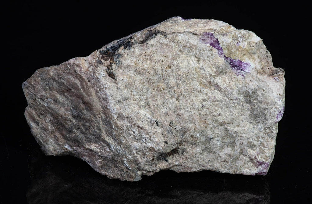 A deeply tenebrescent hackmanite red sodalite specimen from Greenland