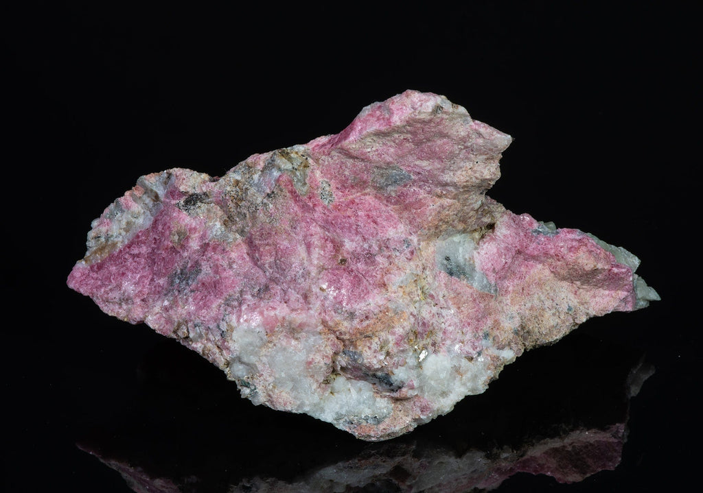 An incredible, unusual gemmy and extremely tenebrescent tugtupite specimen from Kangerlussaq.