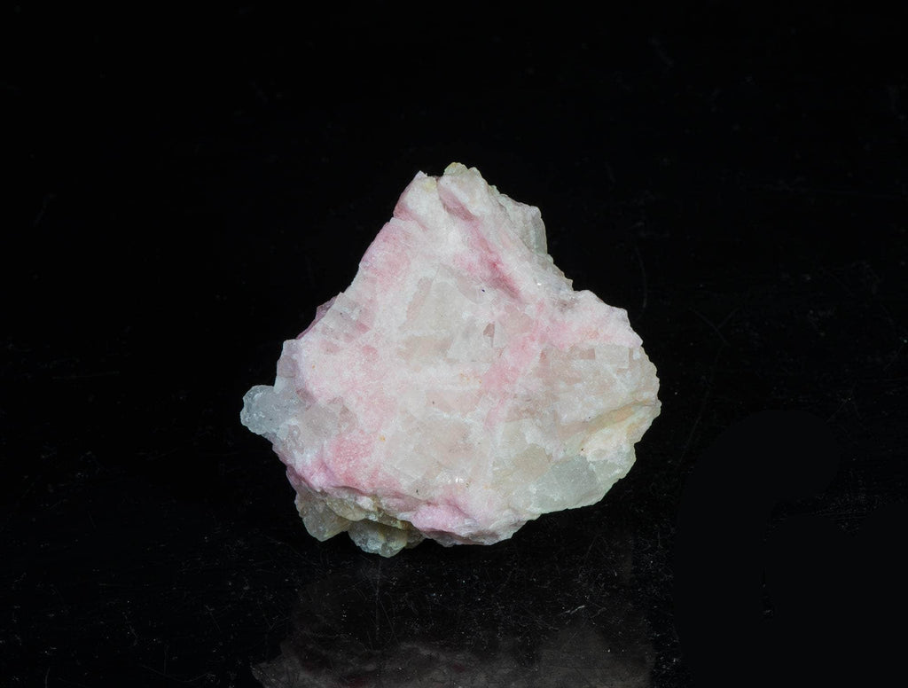 A classic piece of bright red fluorescent tugtupite 