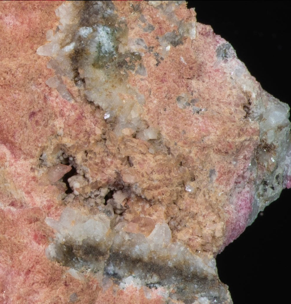 An incredible, unusual gemmy and extremely tenebrescent tugtupite specimen from Kangerlussaq.