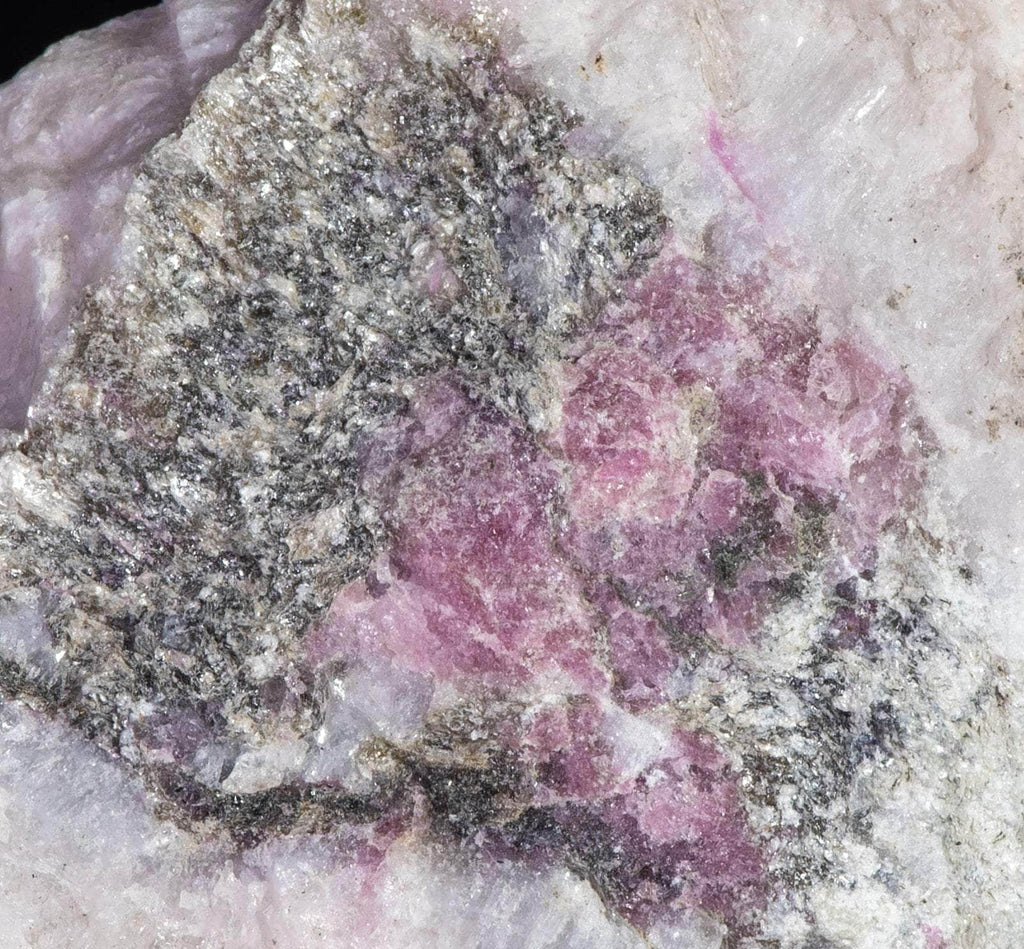 A mineral specimen that features rich polylithionite, tugtupite and chkalovite.