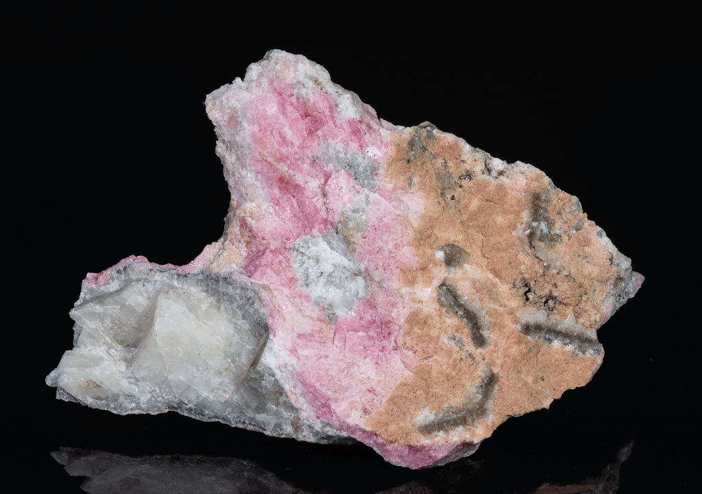 An incredible, unusual gemmy and extremely tenebrescent tugtupite specimen from Kangerlussaq.