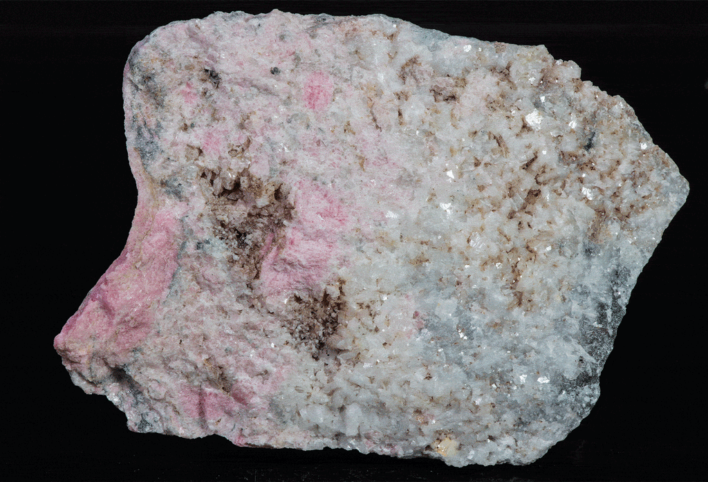An incredible, unusual gemmy and extremely tenebrescent tugtupite specimen from Kangerlussaq. Vugs with large and well-formed, gemmy tugtupite crystals 