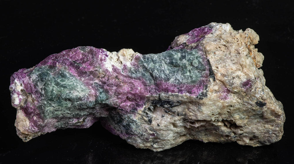 Fluorescent sodalite (Hackmanite) from Greenland with deep tenebrescence.