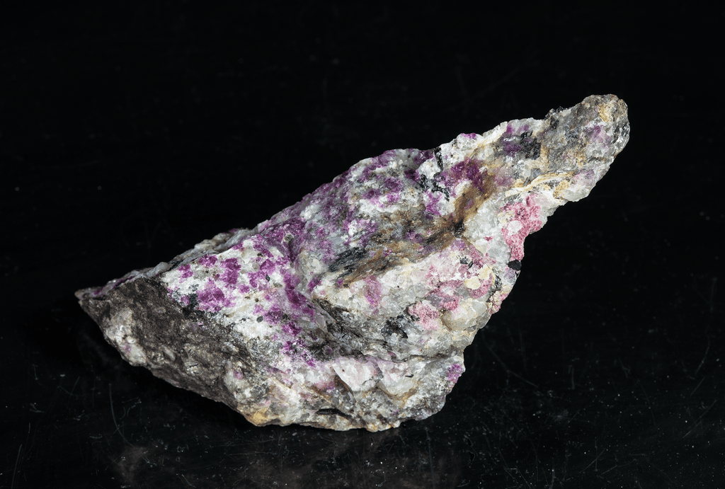 tugtupite (cherry red under shortwave UV light), fluorecent sodalite (orange) and black arfvedsonite