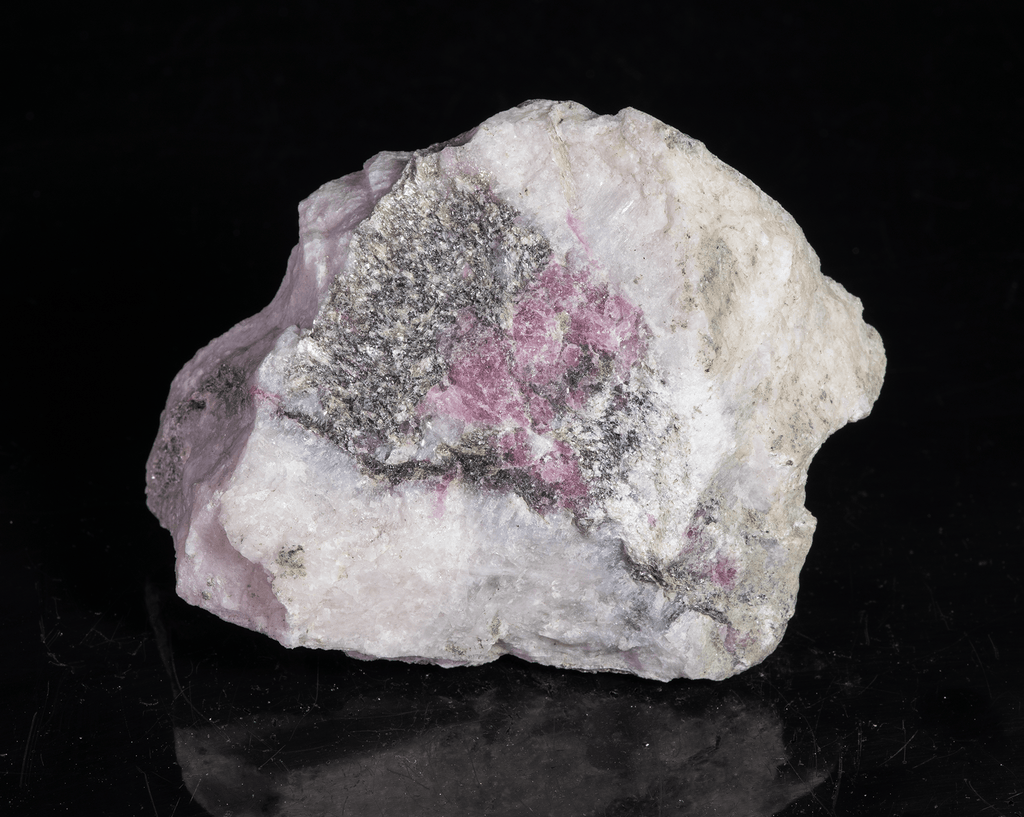 A mineral specimen that features rich polylithionite, tugtupite and chkalovite.