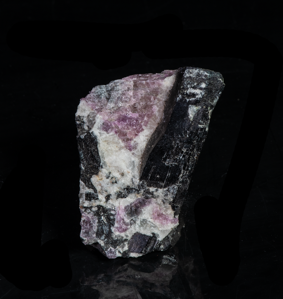 tenebrescent and fluorescent sodalite with an arfvedsonite crystal