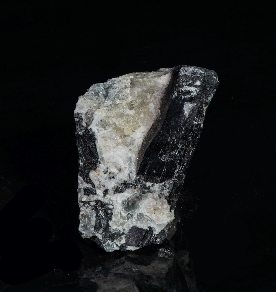 tenebrescent and fluorescent sodalite with an arfvedsonite crystal