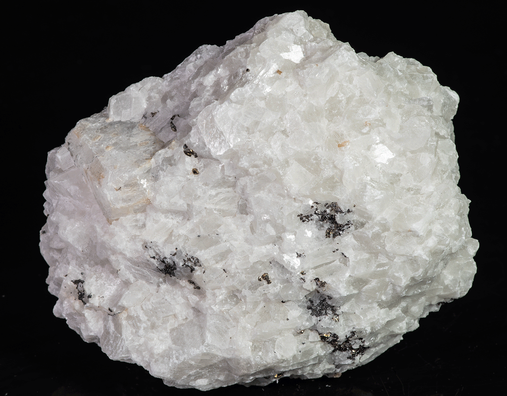 A huge specimen with a very nice, well-formed marialite (scapolite) crystal, fluorescent a bright yellow under longwave UV, on a calcite matrix