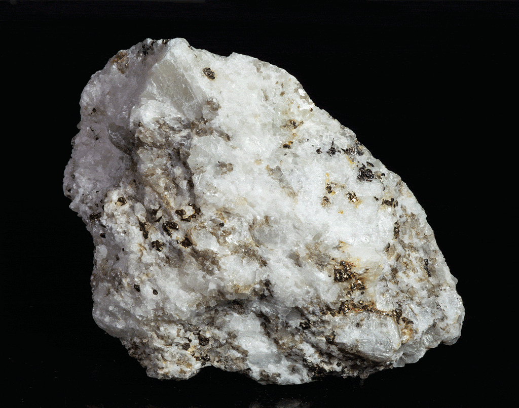 A nice specimen with Marialite (scapolite) crystals, fluorescent a bright yellow longwave, on a calcite matrix.