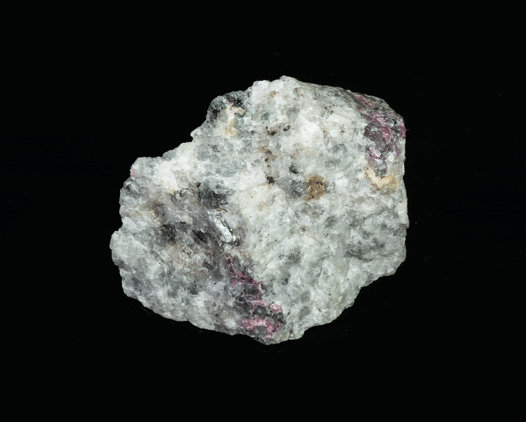 A deeply tenebrescent hackmanite sodalite specimen with minor tugtupite
