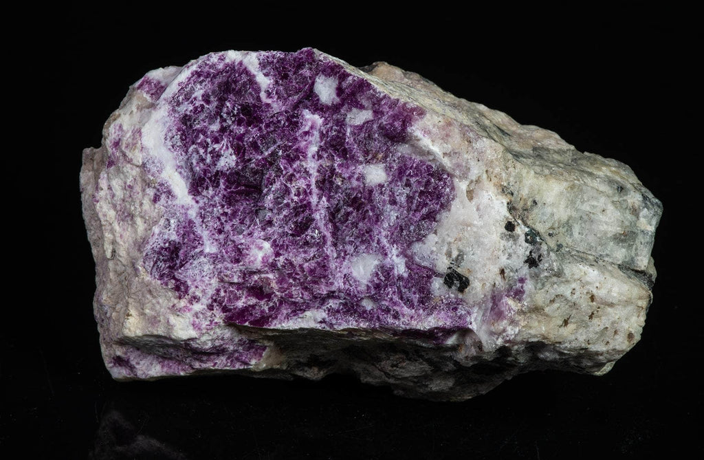 A deeply tenebrescent hackmanite red sodalite specimen from Greenland