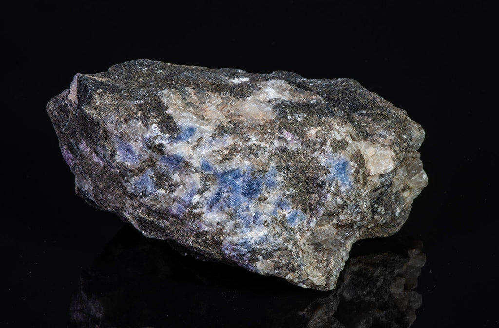 A piece of blue sodalite fluorescent under UV from Greenland