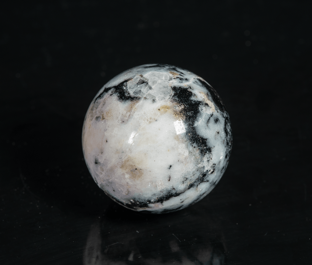 tugtupite and silver polylithionite sphere from Greenland