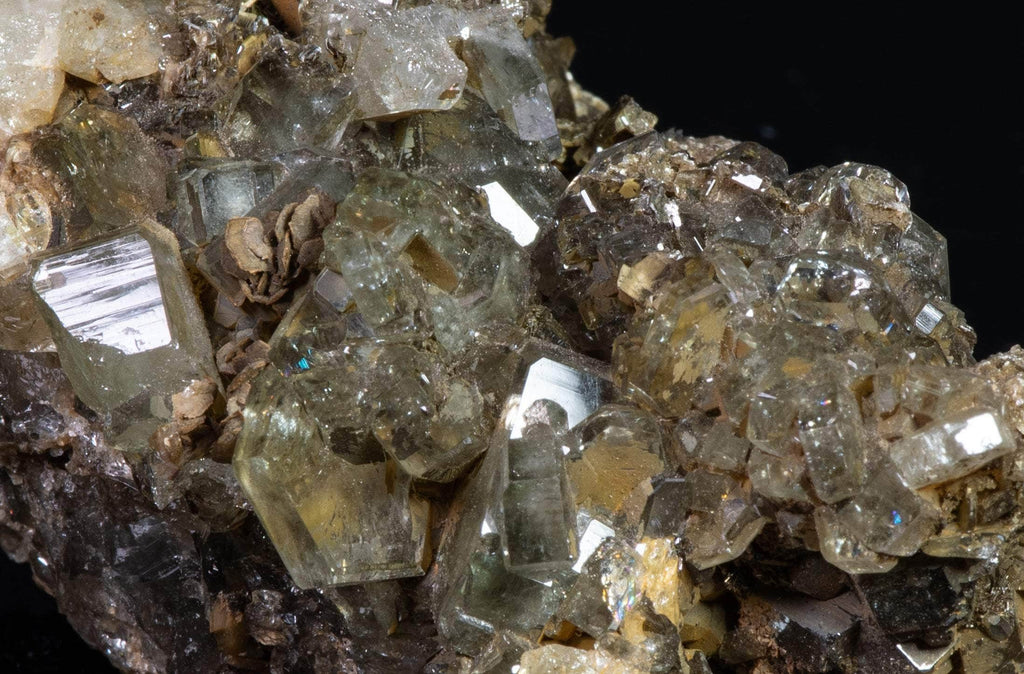 Nicely formed apatite crystals brightly fluorescent under shortwave and midwave UV light. 