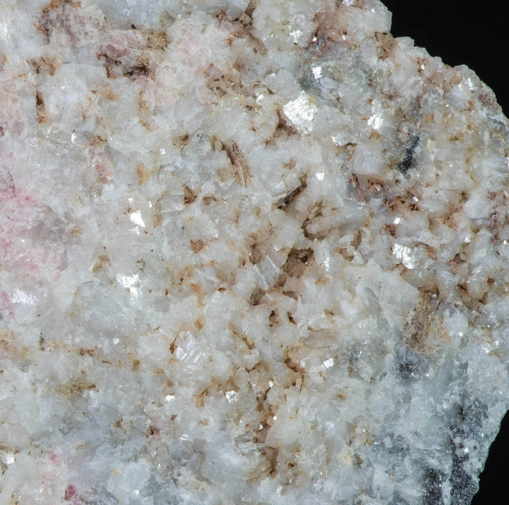 An incredible, unusual gemmy and extremely tenebrescent tugtupite specimen from Kangerlussaq. Vugs with large and well-formed, gemmy tugtupite crystals 