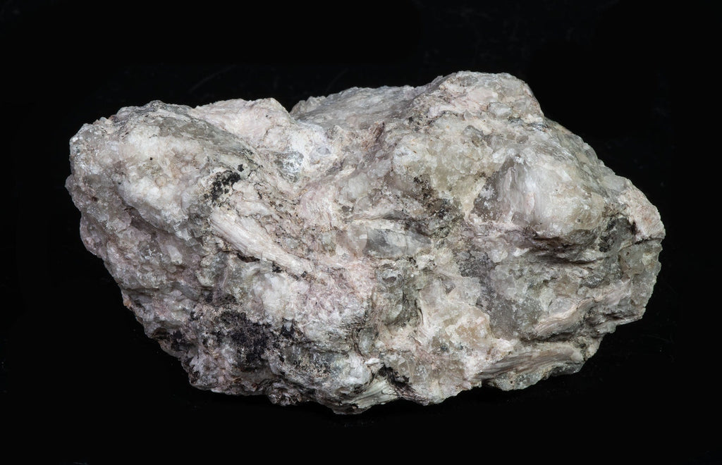 A mineral specimen of sorensenite crystals embedded in matrix