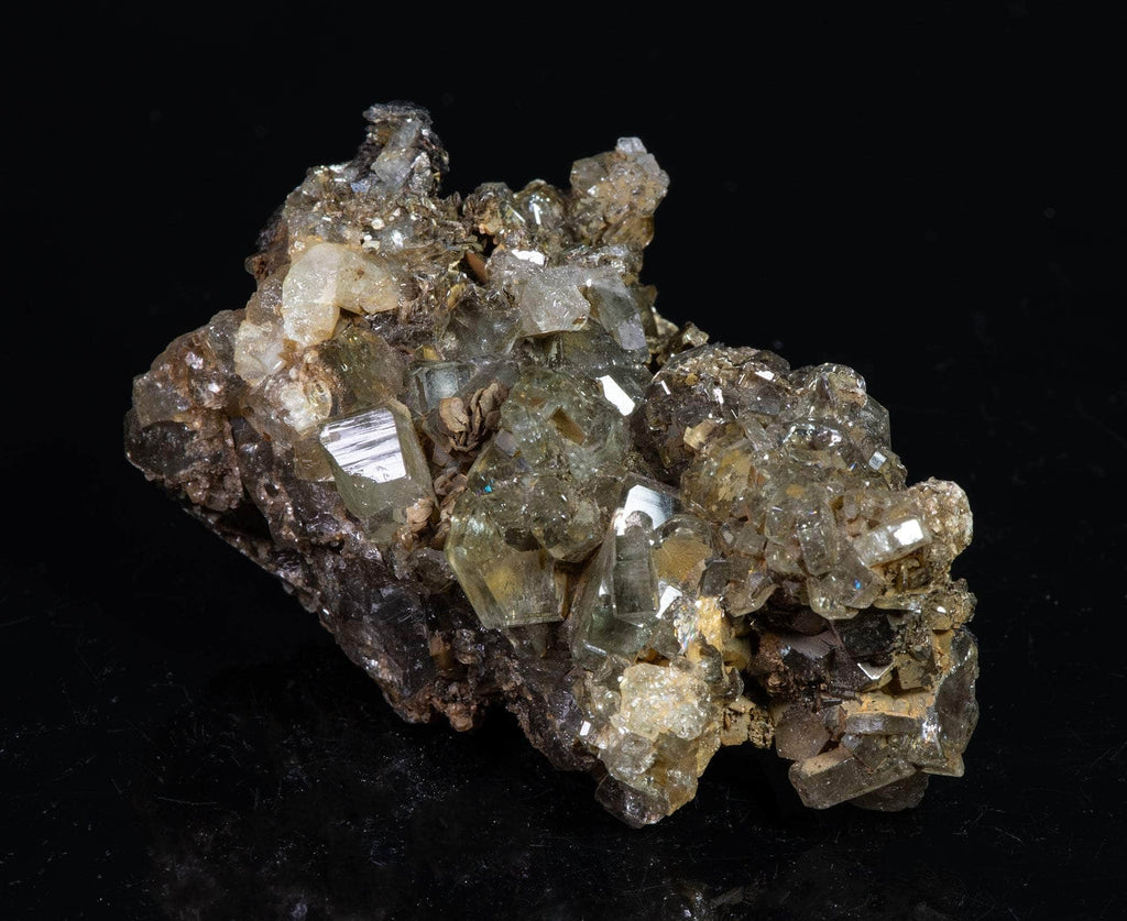 Nicely formed apatite crystals brightly fluorescent under shortwave and midwave UV light. 