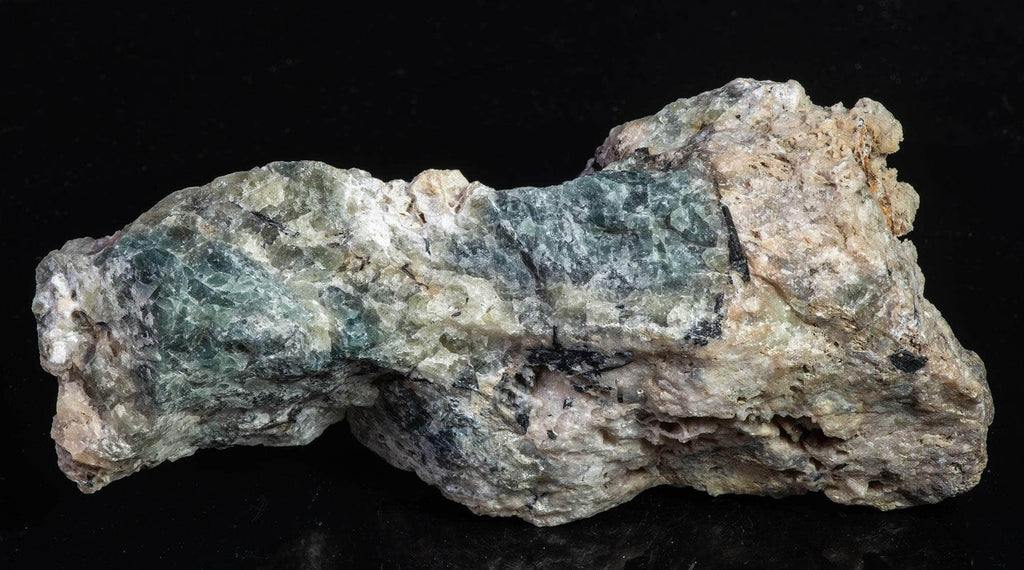 Fluorescent sodalite (Hackmanite) from Greenland with deep tenebrescence.
