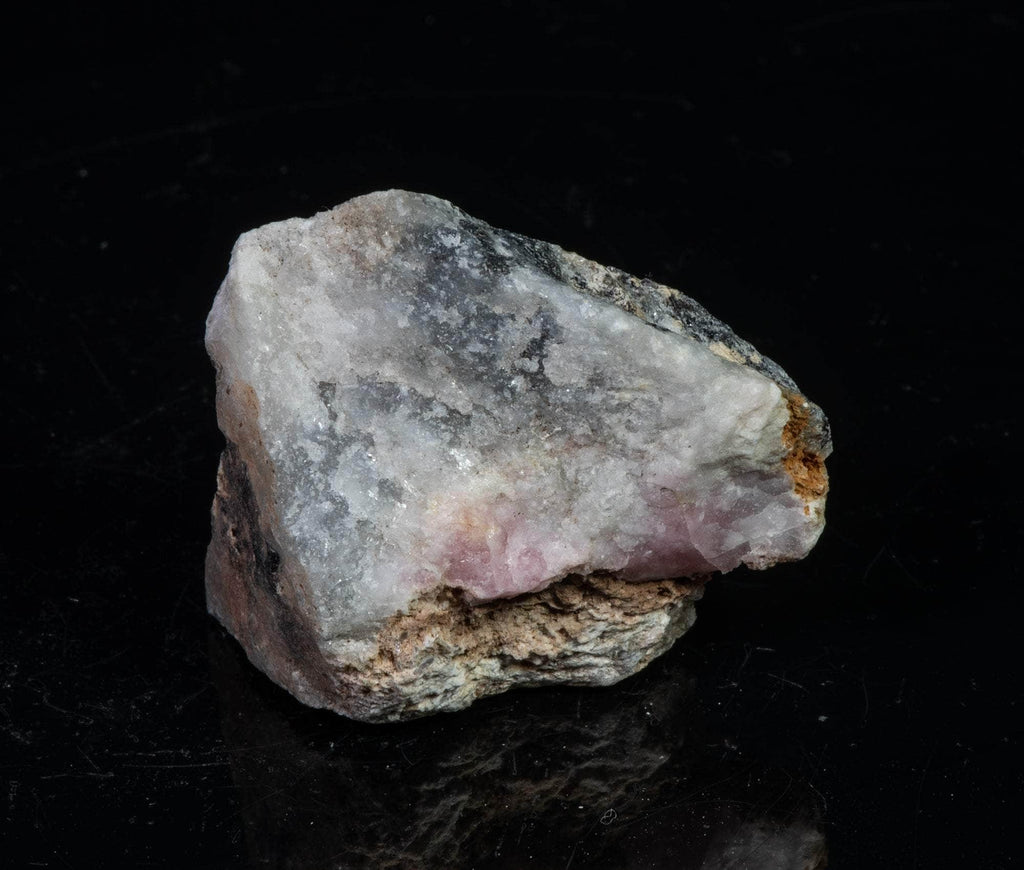 A classic piece of bright red fluorescent tugtupite 