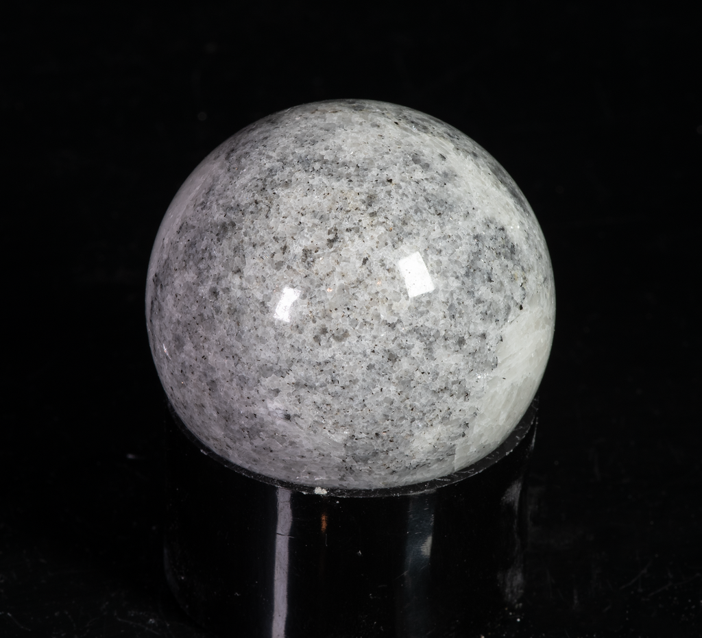 fluorescent diopside and chondrodite sphere from canada