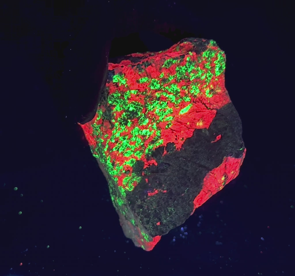 fluorescent calcite, zincite & willemite from Sterling Hill Mine, NJ. Brilliant red and green under shortwave UV