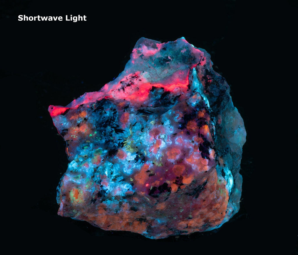 A nice piece of tenebrescent fantasy rock with broad areas of blue fluorescing analcime and exquisite tugtupite veining.  Areas of orange are fluorescent sodalite.