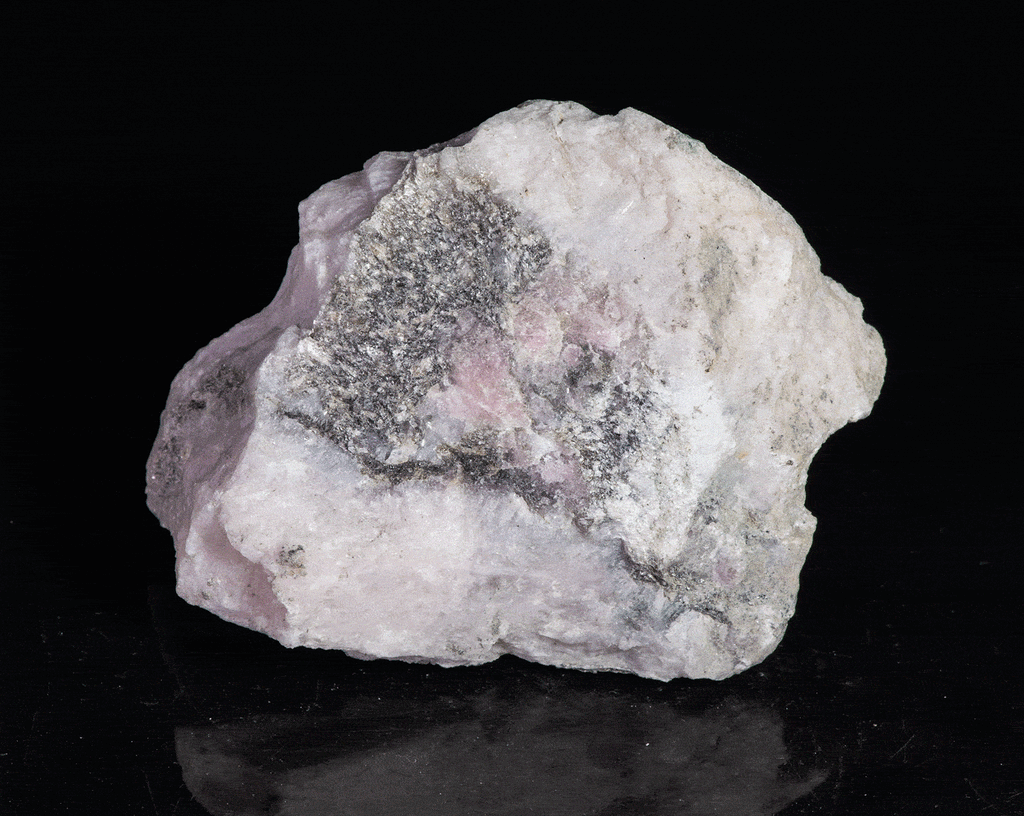 A mineral specimen that features rich polylithionite, tugtupite and chkalovite.