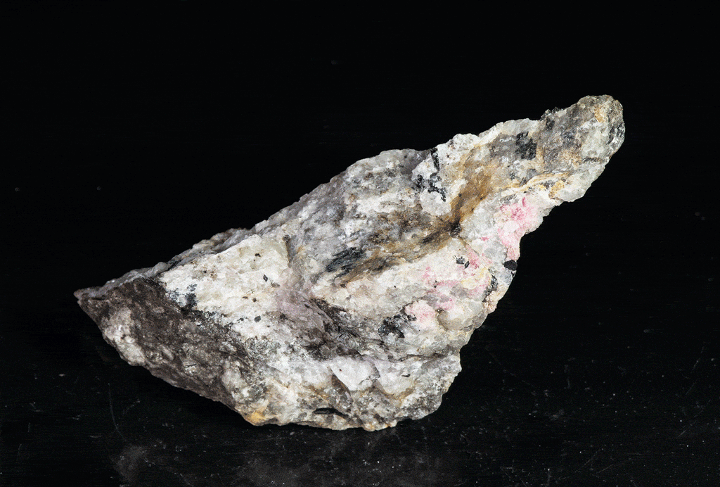 tugtupite (cherry red under shortwave UV light), fluorecent sodalite (orange) and black arfvedsonite