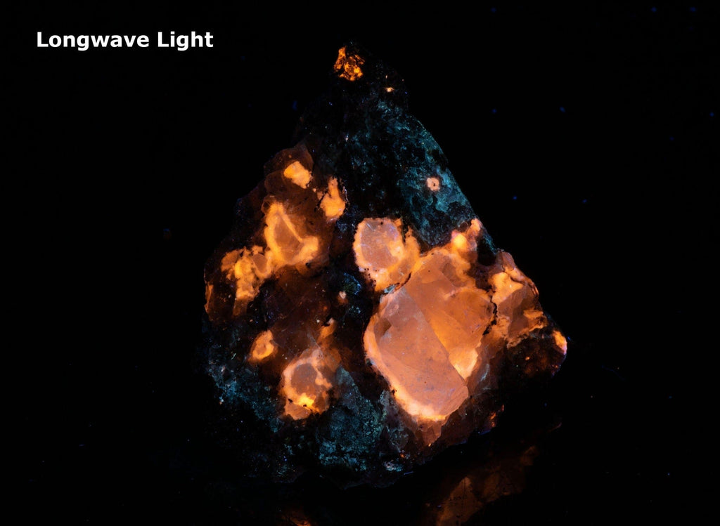 A miniature piece of fantasy rock containing tugtupite, sodalite and other rare minerals from Greenland