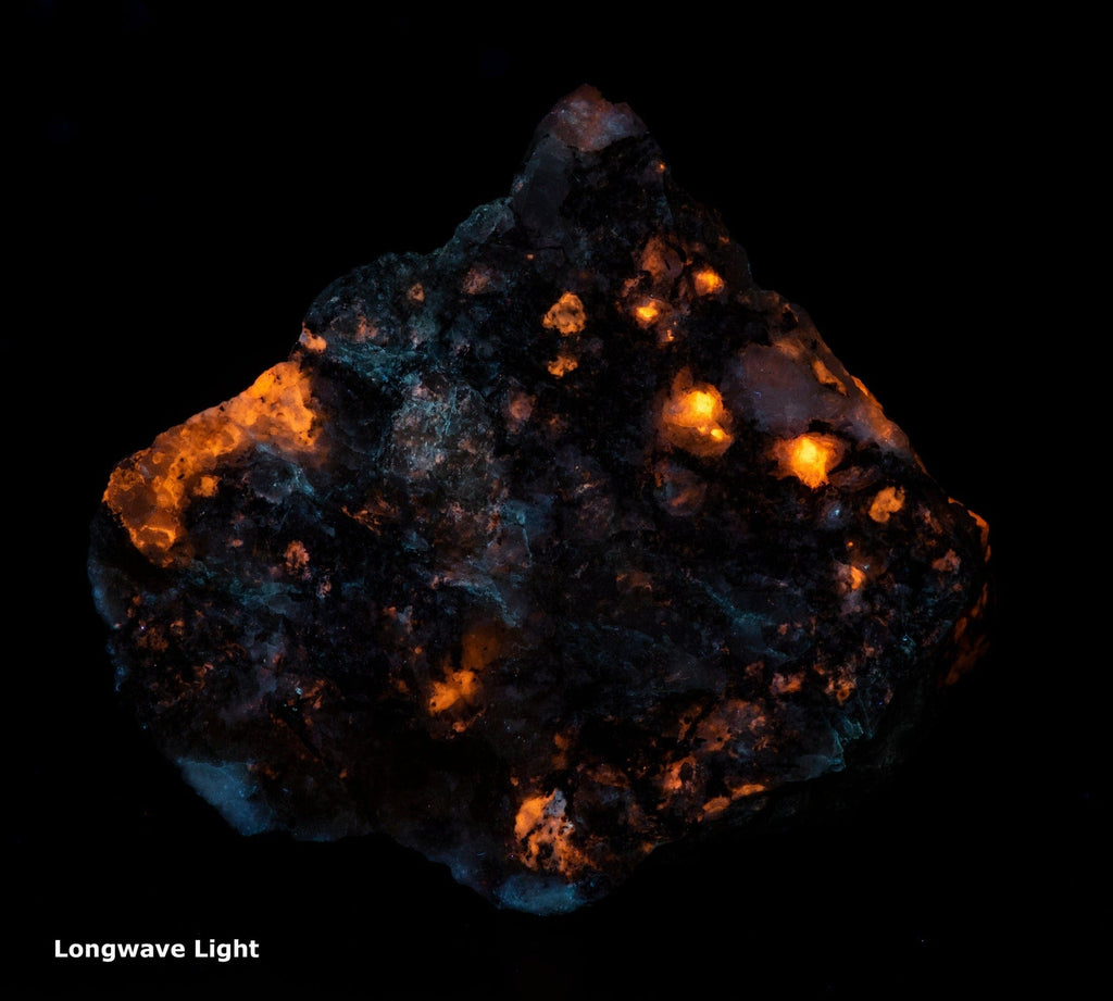 A photo of a fantasy rock from Greenland containing Tugtupite and Sodalite