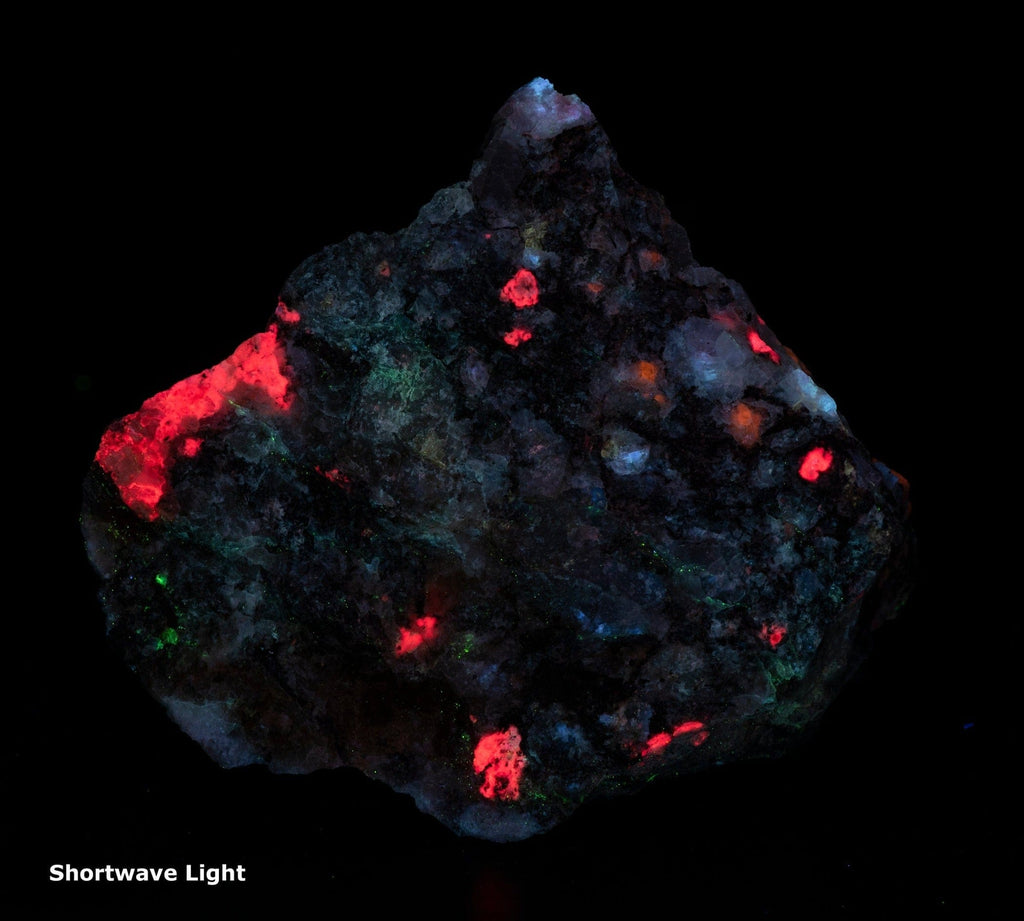 A photo of a fantasy rock from Greenland containing Tugtupite and Sodalite
