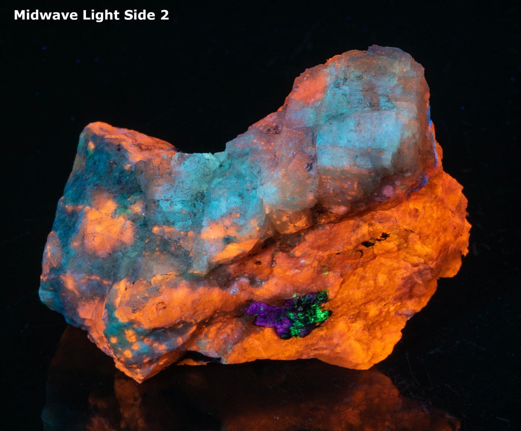 A piece of fluorescent sodalite with many unknown minerals