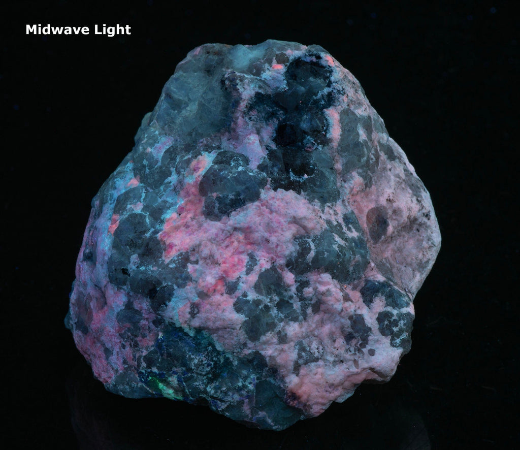 A mineral specimen of bright cherry red tugtupite from Greenland