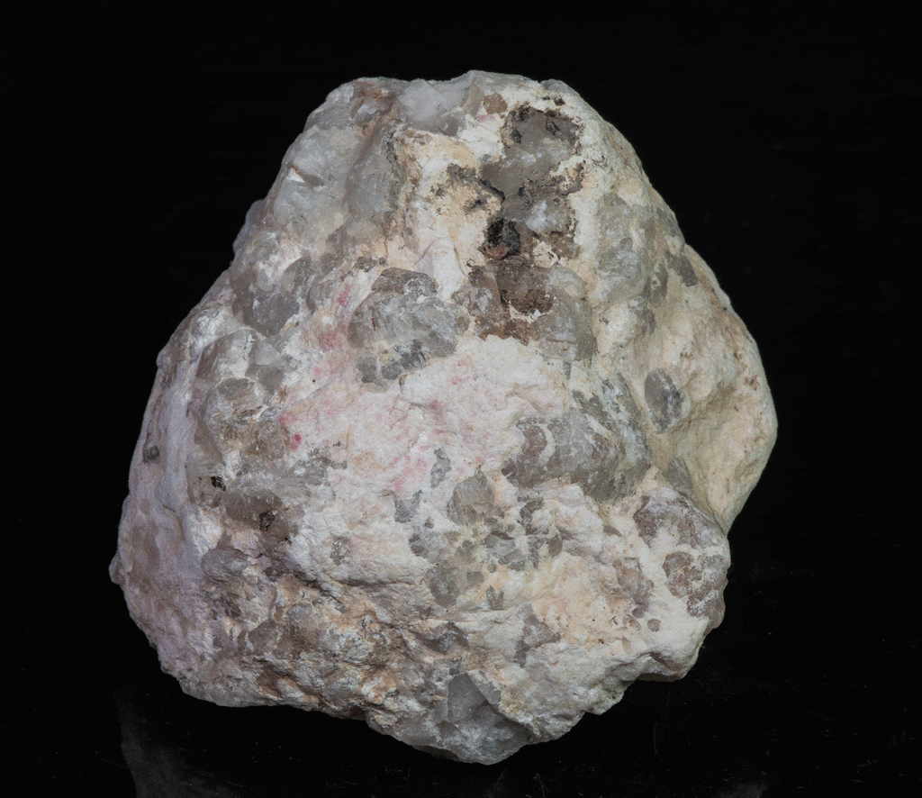 A mineral specimen of bright cherry red tugtupite from Greenland