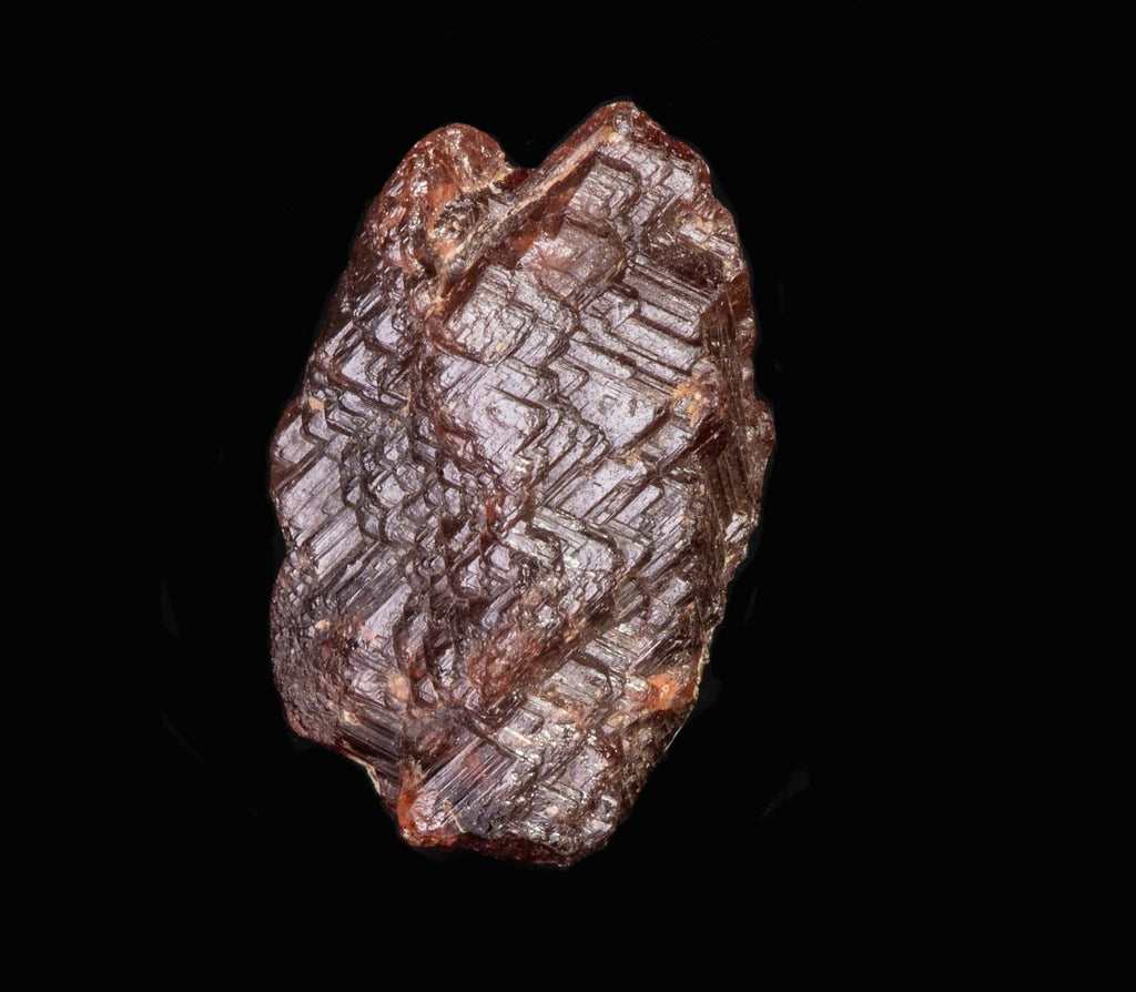 A nice, gemmy raw garnet crystal from Pocos dos Cavalos, Ceara, Brazil