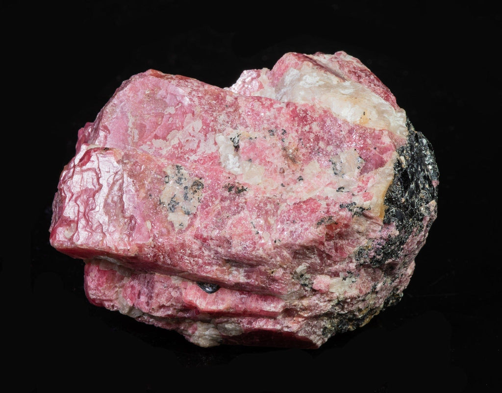 A Pink Rhodonite Crystal with Fluorescing Calcite from Franklin Mine