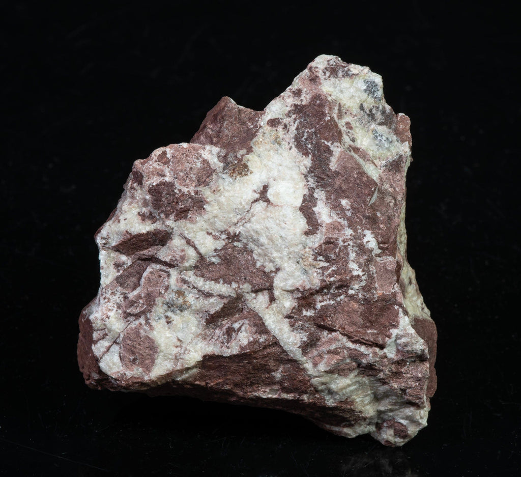 A mineral specimen of calcite and willemite from Puttapa Mine in Australia