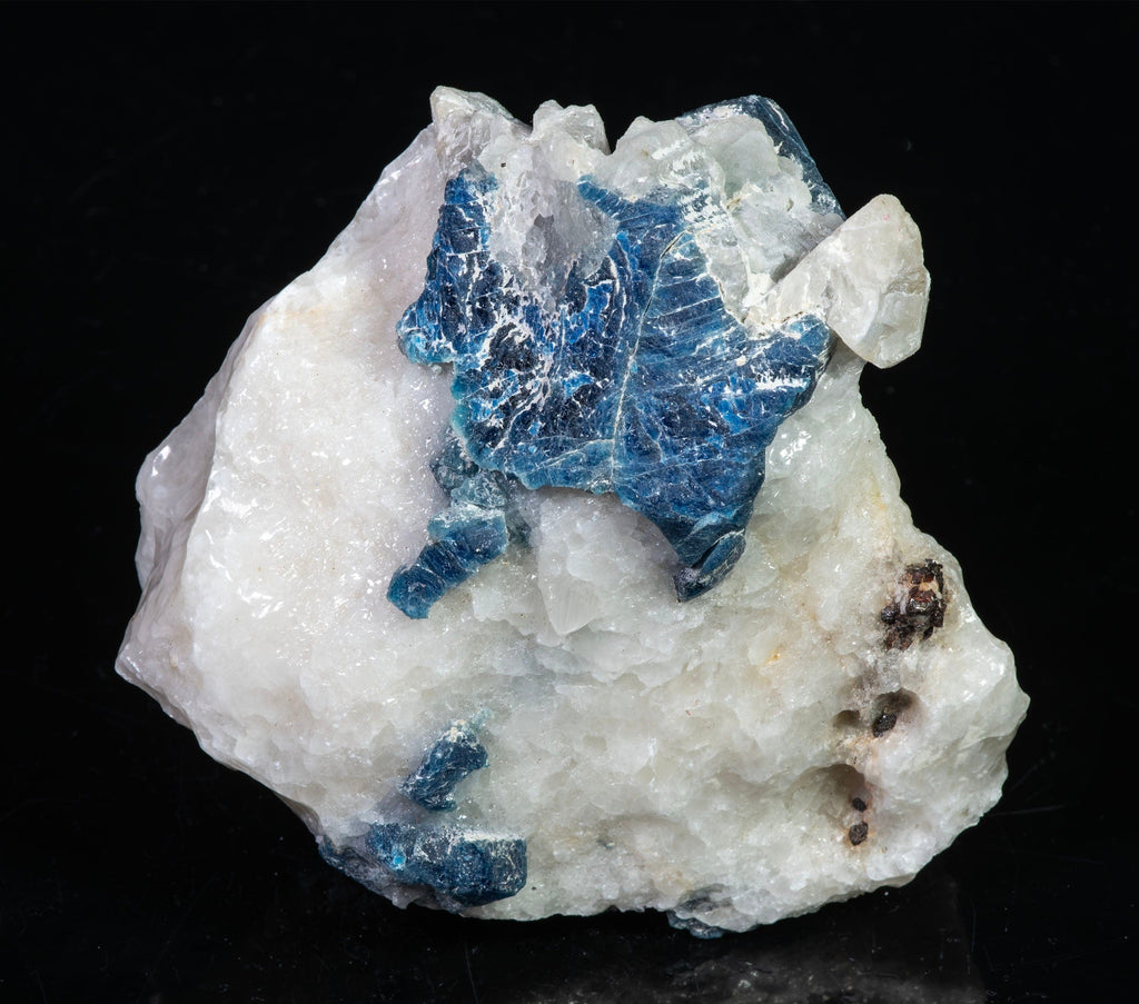 A mineral specimen of blue “hauyne” atop a matrix of calcite from Afghanistan