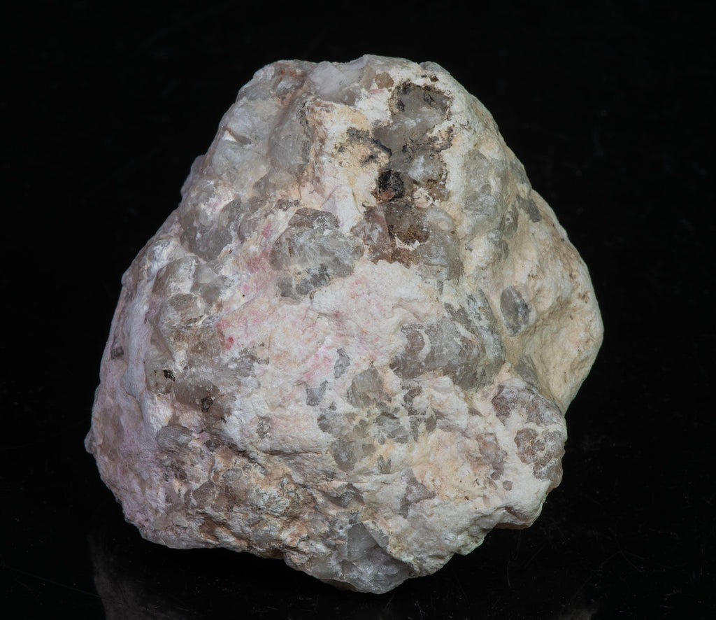 A mineral specimen of bright cherry red tugtupite from Greenland
